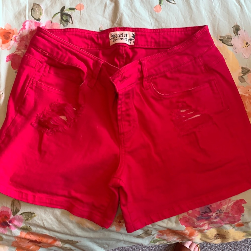 Hot pink shorts with rips